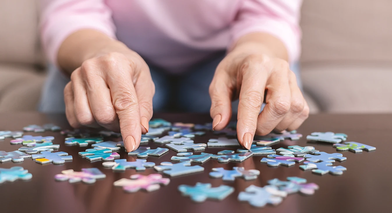 Senior solving puzzle