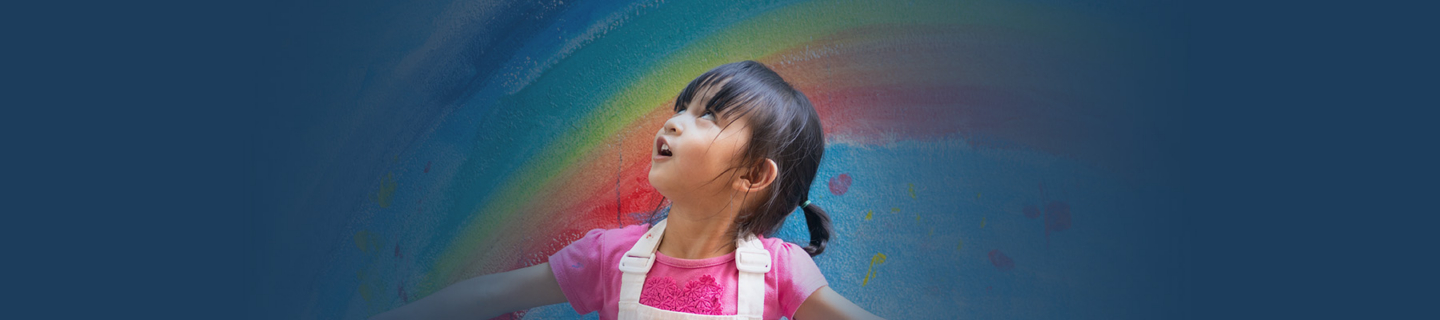 Child marveled at painted rainbow