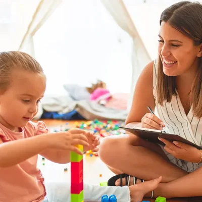 Therapist and child amid structured play