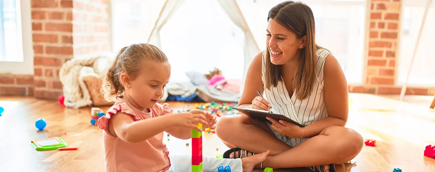 Therapist and child amid structured play