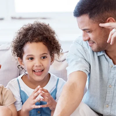 Children expressing themselves with parents and speech therapist
