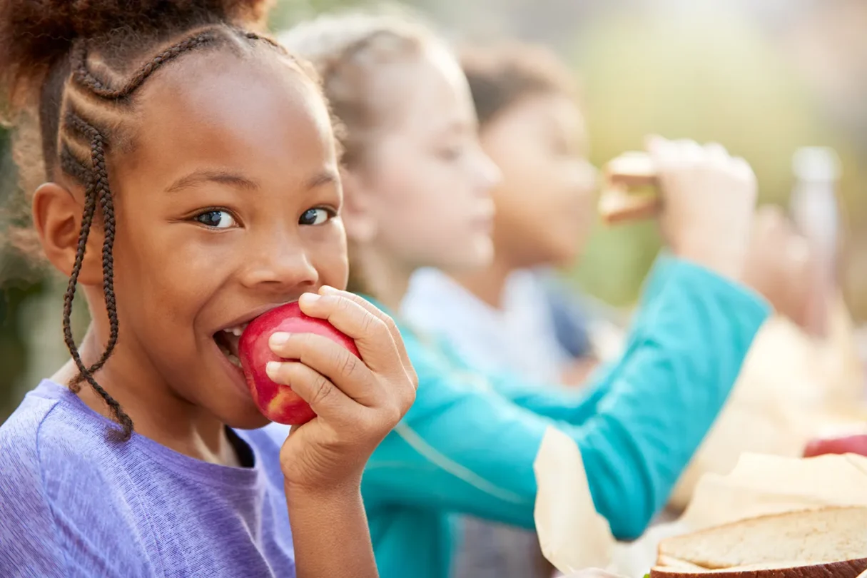 Kids eating together outside