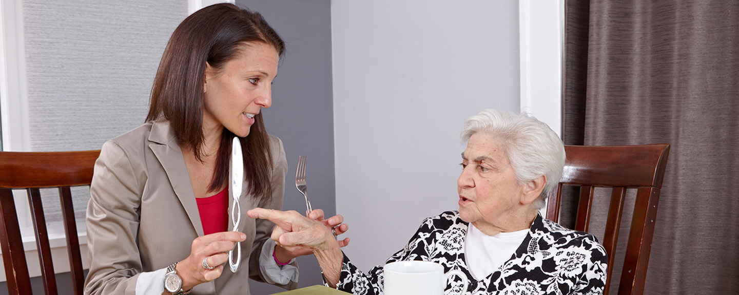 Photo of Lori with an elder patient