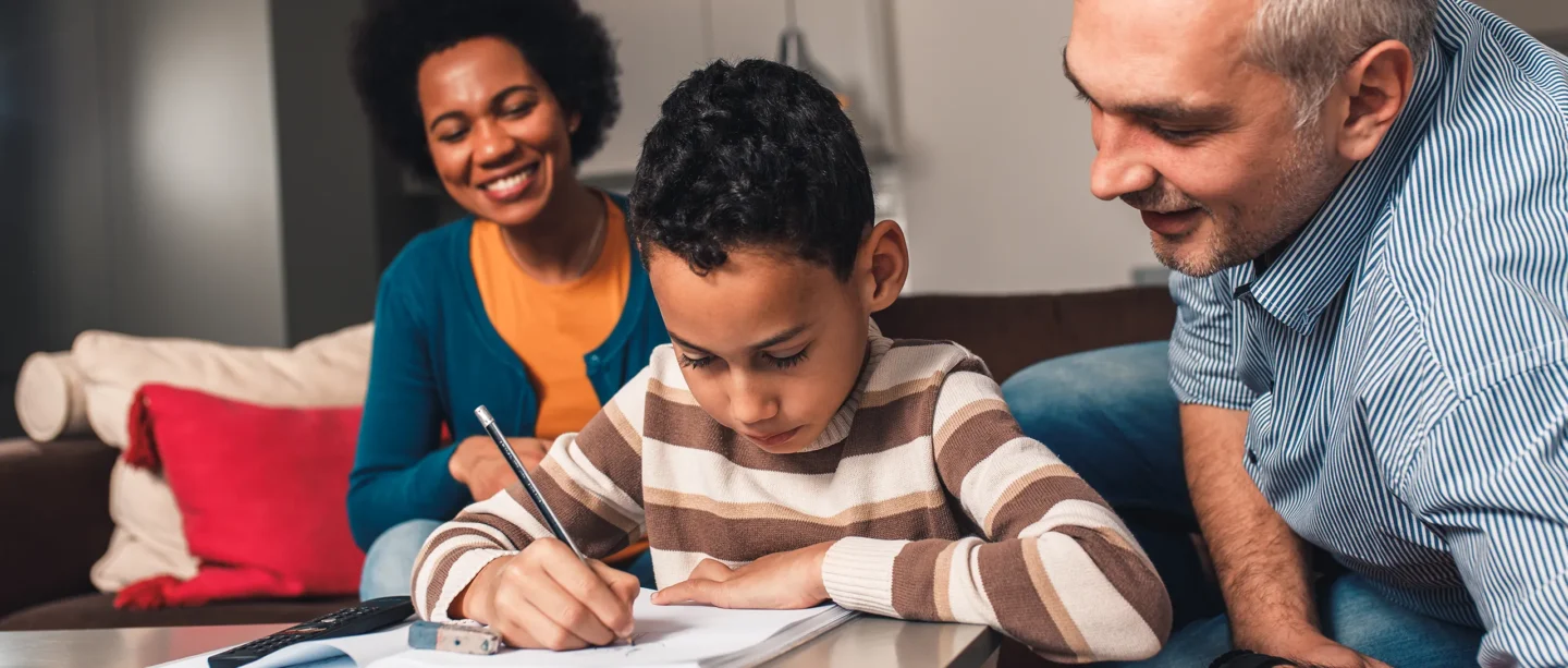 Child studying with parents
