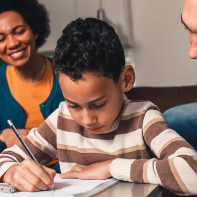 Child studying with parents